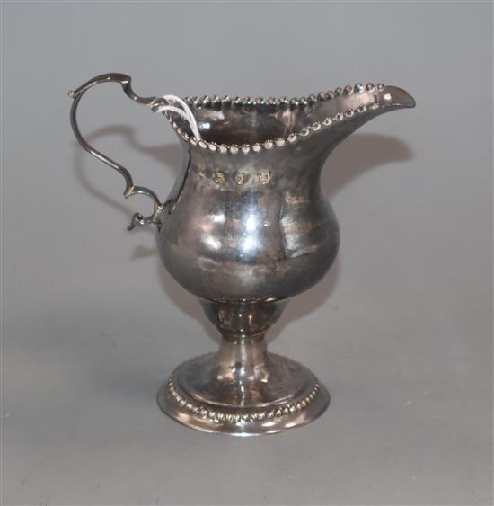 A George III silver inverted pear shaped pedestal cream jug, William Cattell, London, 1779, 11.4cm.